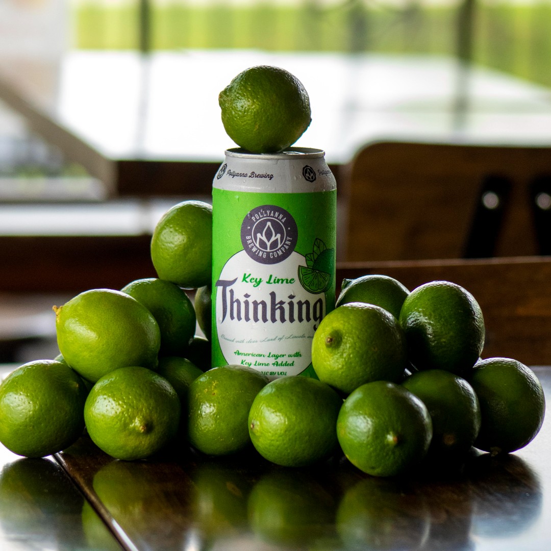 Can of Key Lime Thinking, surrounded by a number of key limes