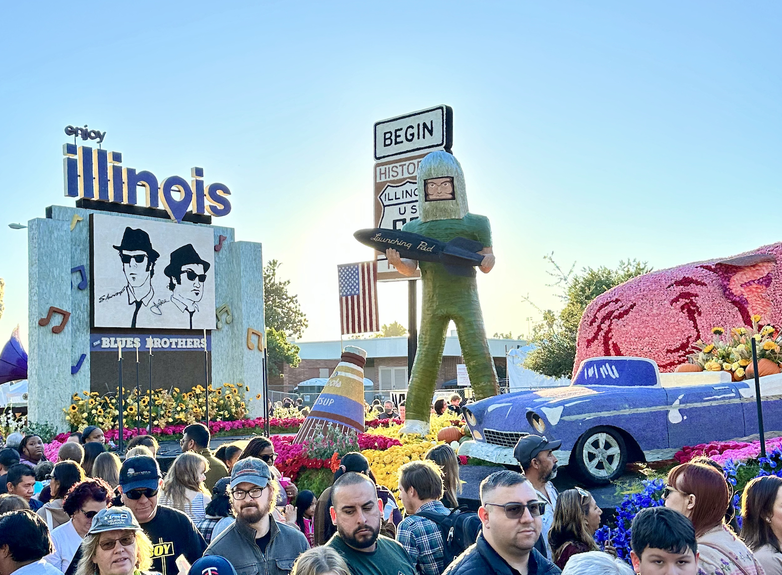 Enjoy Illinois Route 66 float surrounded by people at Floatfest 2024